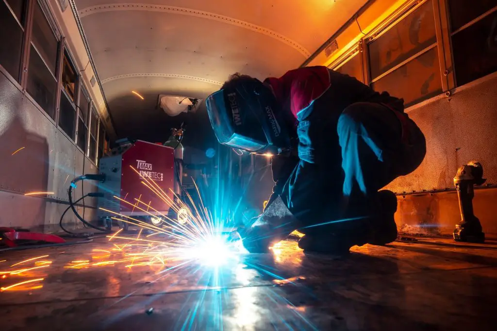 Welding while wearing an auto-darkening welding helmet